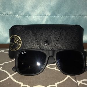 All black Ray Ban Glasses.